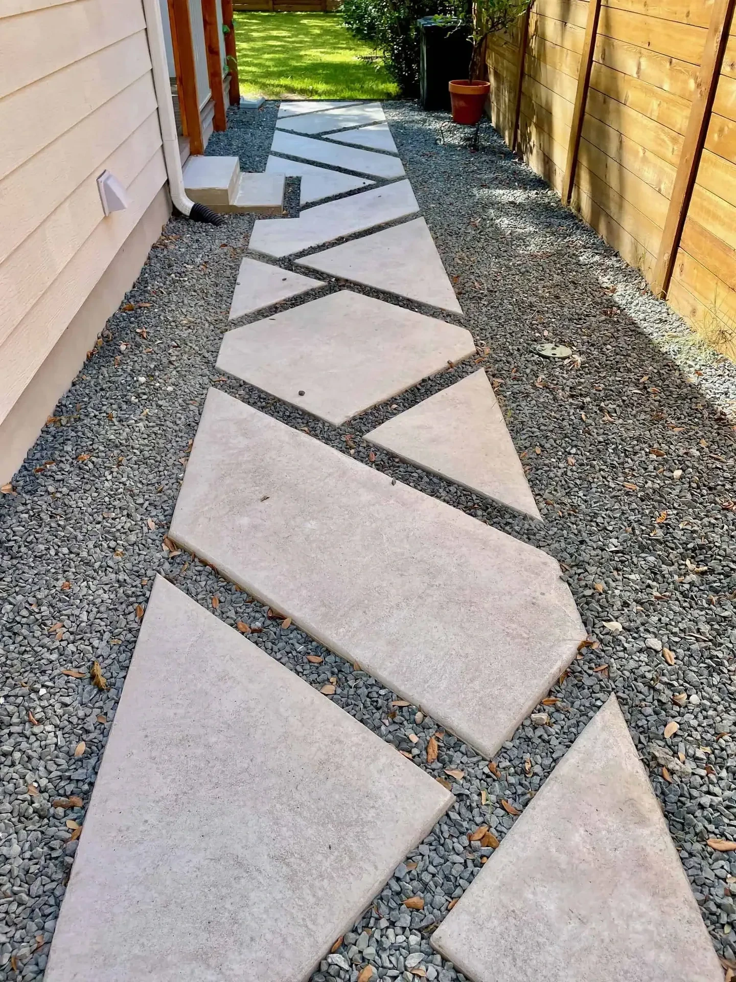 Westlake Steel — tiered 1/4-inch Corten steel retaining walls, marbled concrete slabs, 24V FCOB lighting, specimen agaves — Westlake Hills Austin TX