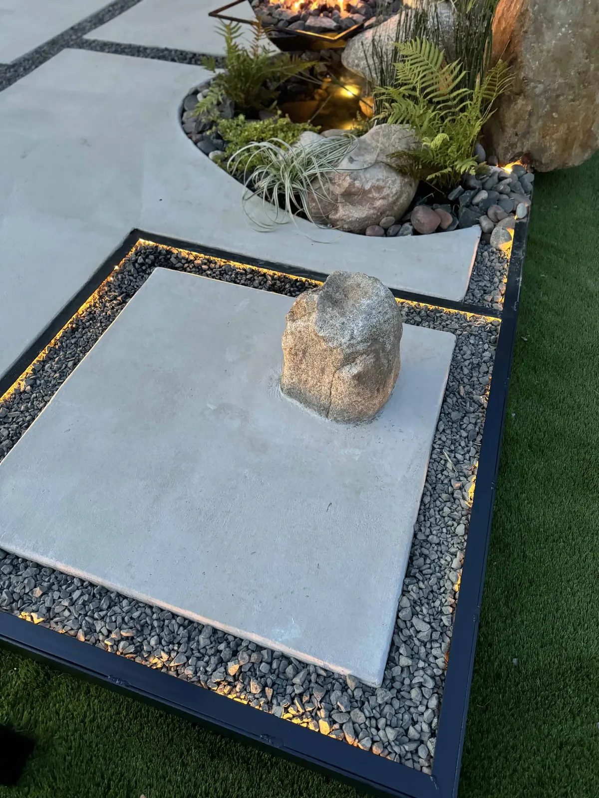 1/4-inch steel edging holding a curved line between native plantings and decomposed granite in Pflugerville
