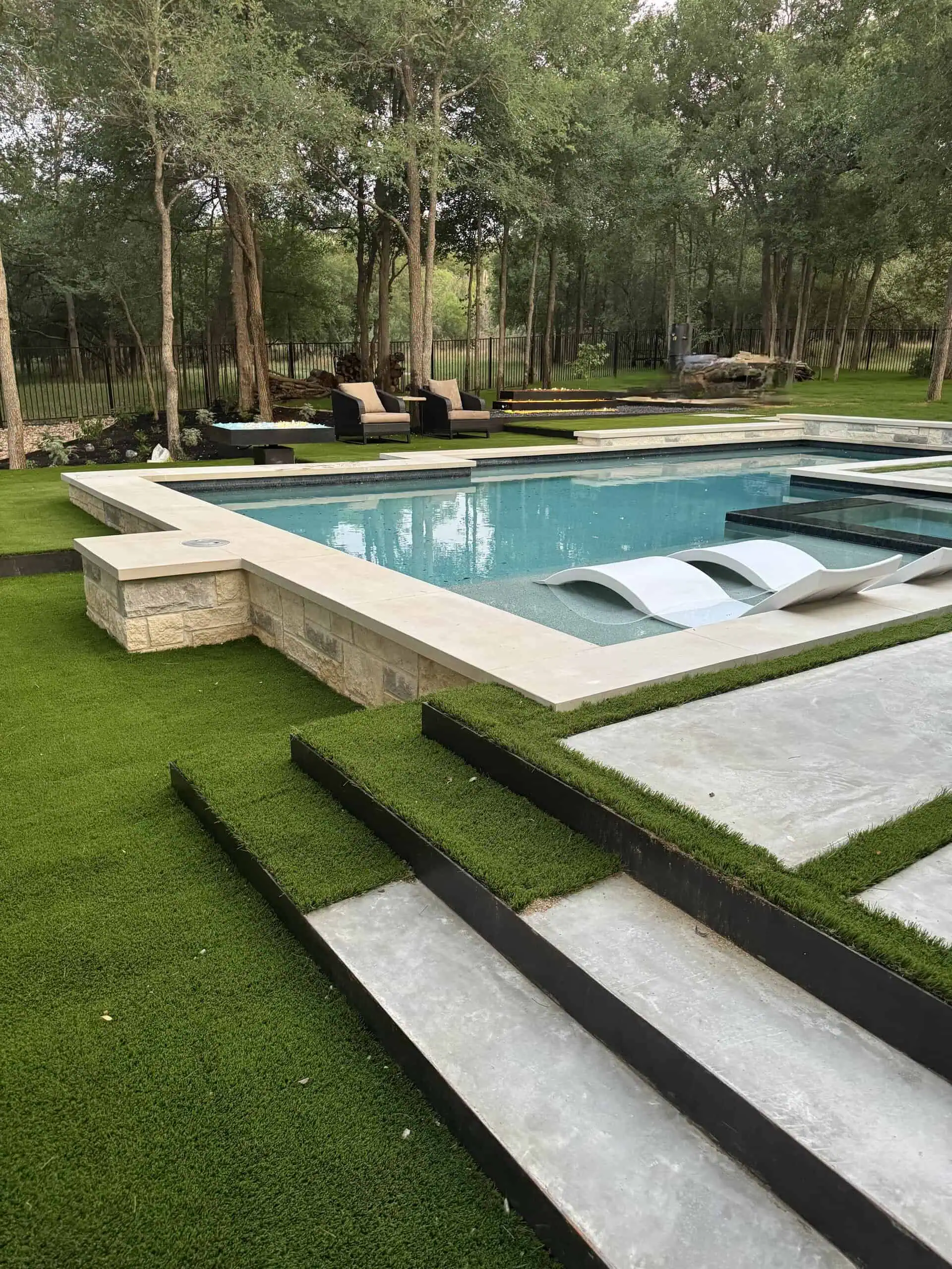 1/4-inch steel terracing steps with synthetic turf and pool — Austin TX