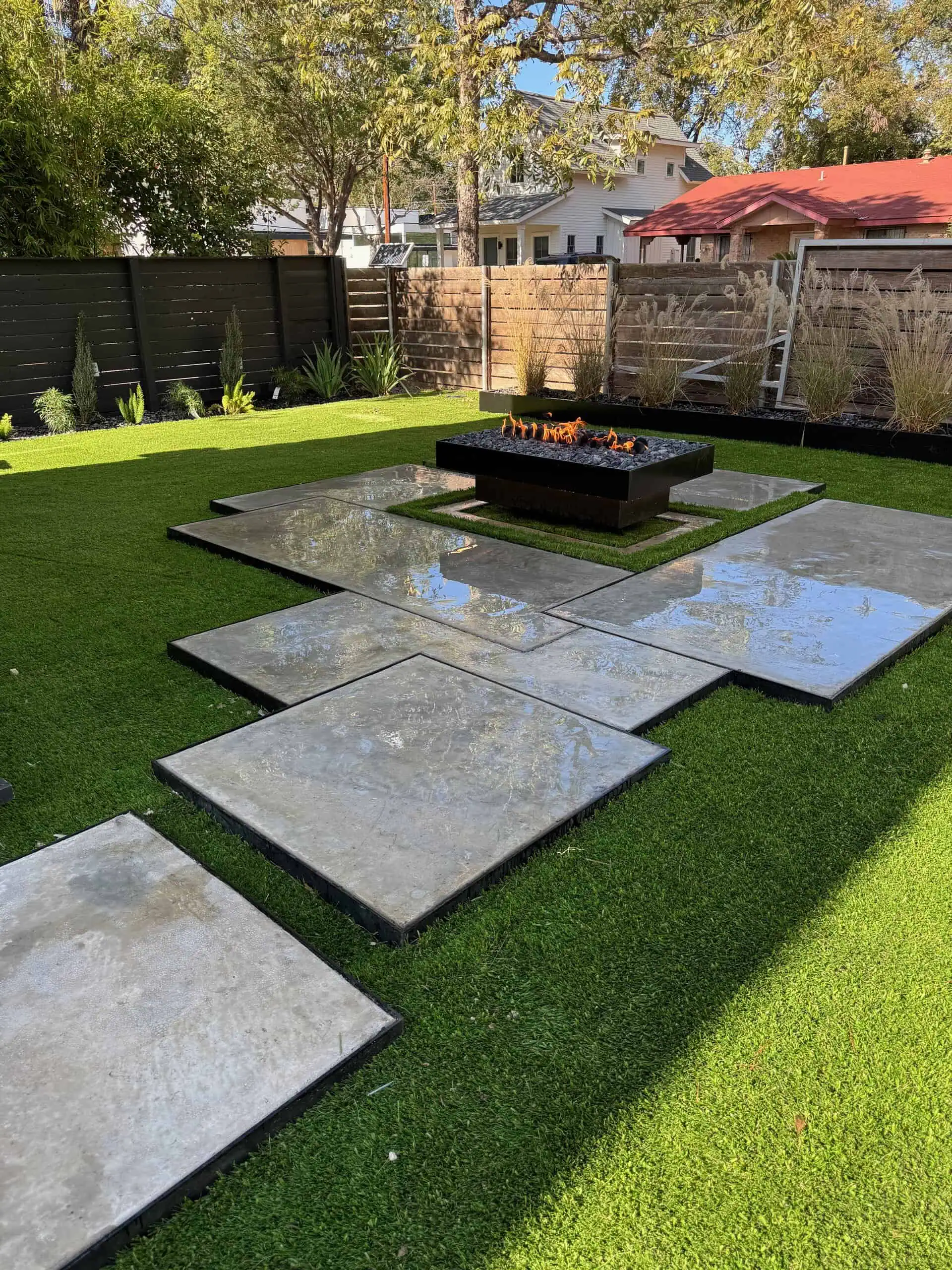 Concrete slabs poured to look like marble with 1/4-inch steel framing and synthetic turf — Austin TX