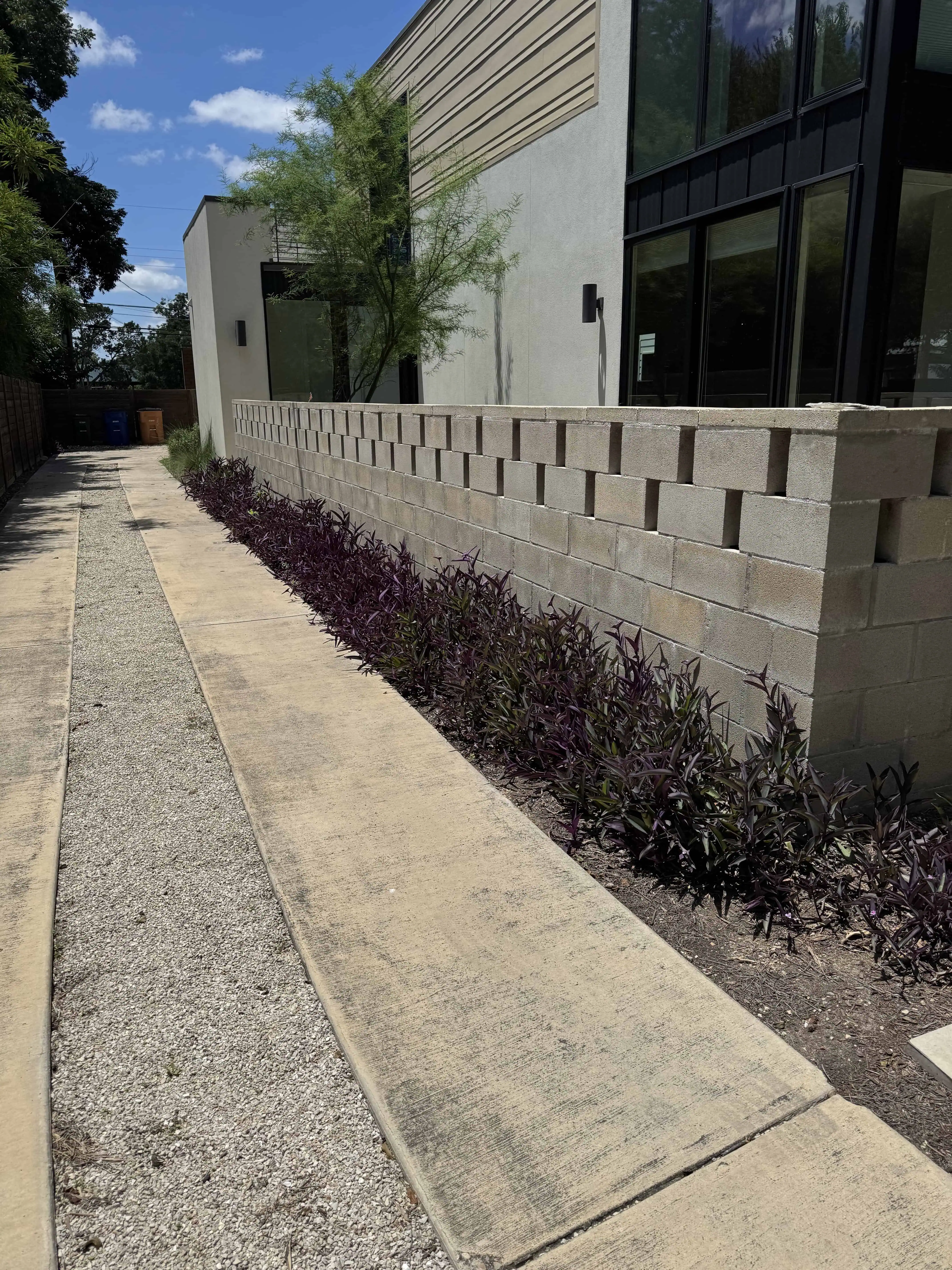 Riverview project before — plain backyard with basic patio